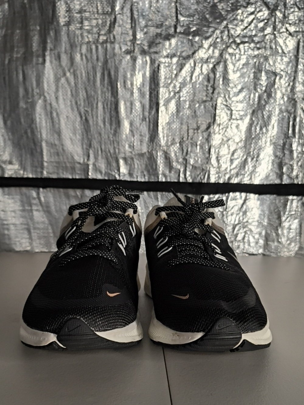 Nike Black and White Running Shoes with Subtle Rose-Gold Swoosh